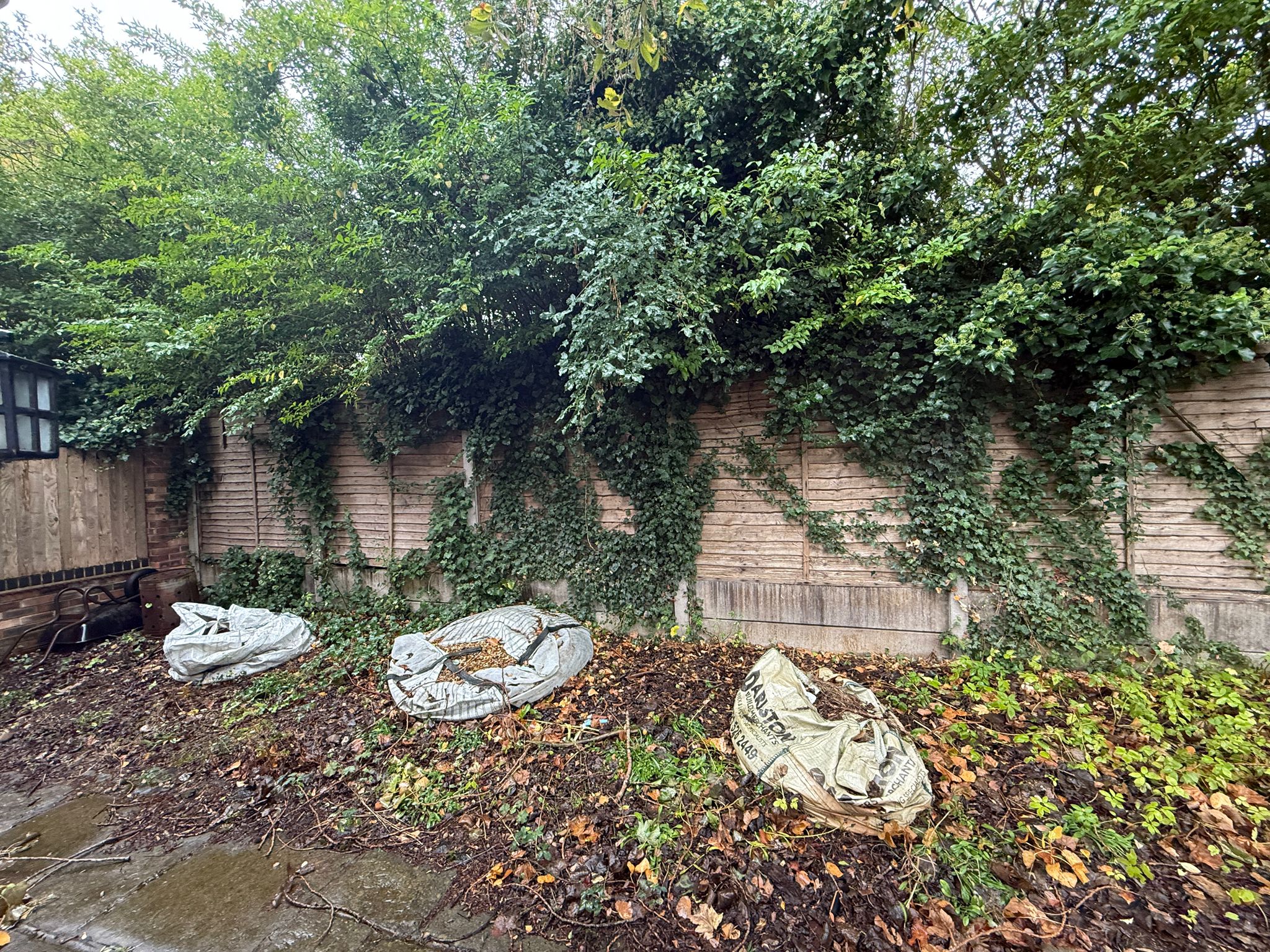 Old damaged fence before replacement